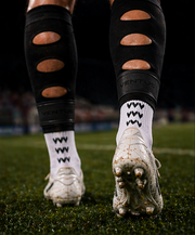 Black Aero Pro-Cut Sleeves with calf vents, worn with Pro-Grip Socks on the pitch
