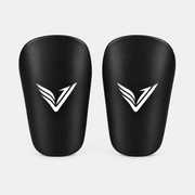 Pair of Stealth Guards mini shin guards in black with the Ventus V, front view