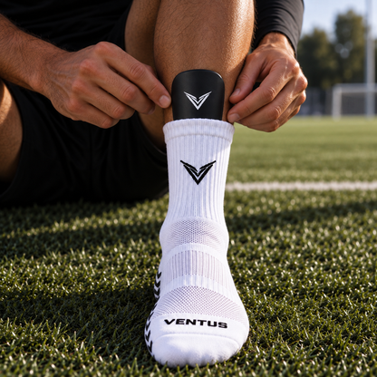 Player sliding a Stealth Guard into a grip sock before a match